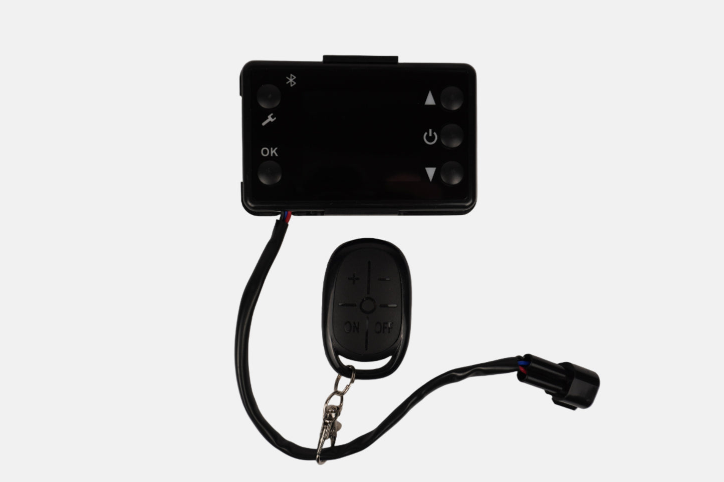 Black remote control device with keychain on a white background
